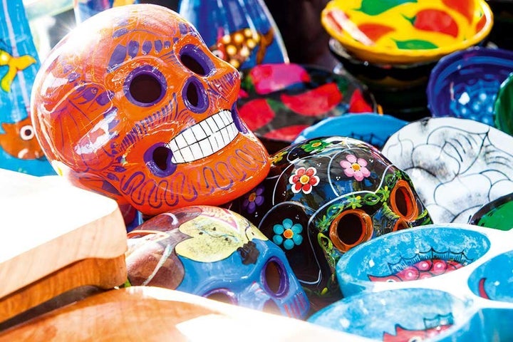 Beautifully hand-painted skulls are offered to souls during Mexican Dia de los Muertos (Day of the Dead) celebrations.