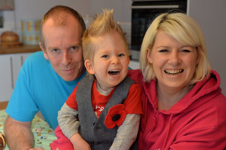 Noah Wall aged two with his parents. 