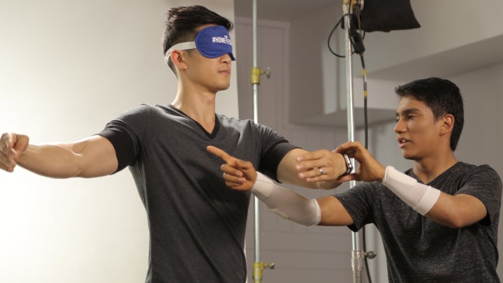 Benjamin Yonattan teaching Harry Shum, Jr. how to dance without sight.