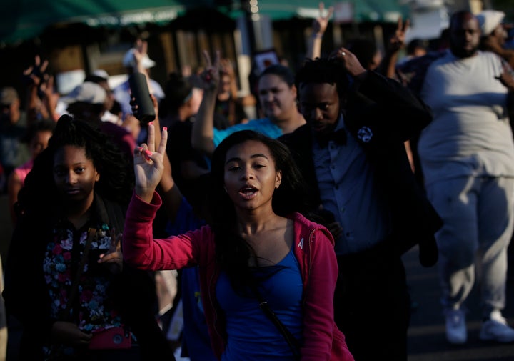 Demonstrators protest the recent uptick in homicides across the city. August is the most violent month in 20 years for the city of Chicago.