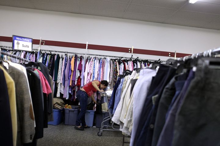A woman shops at a Salvation Army thrift store in Utica, New York. Online clothing resale outlets like ThredUP hope to offer the perks of thrift shopping without the hassle.