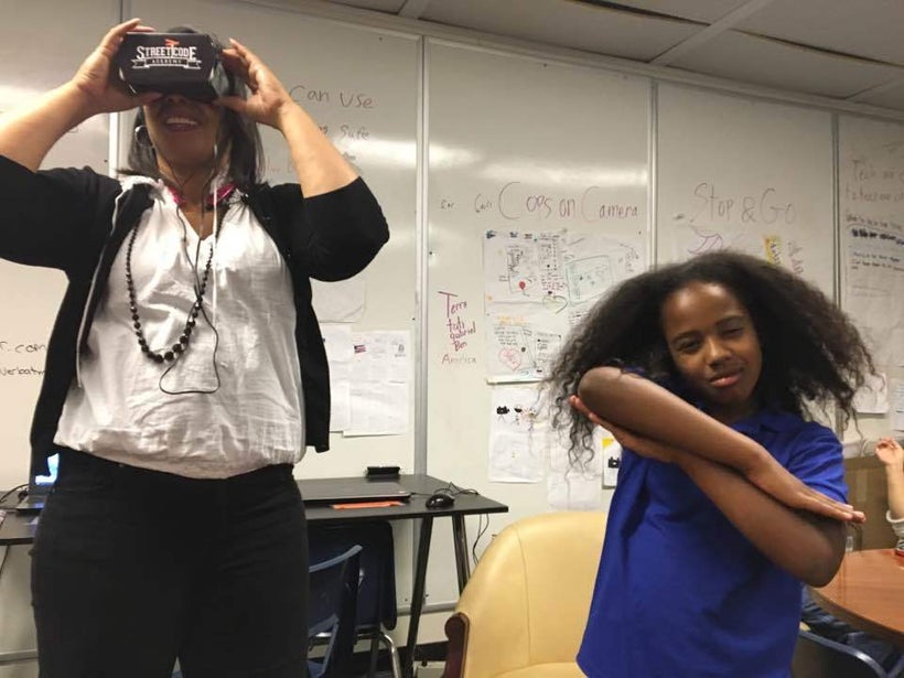 <i>EPA Councilmember Lisa Gauthier enjoying Tati Sobomehin's VR project on her family. </i>