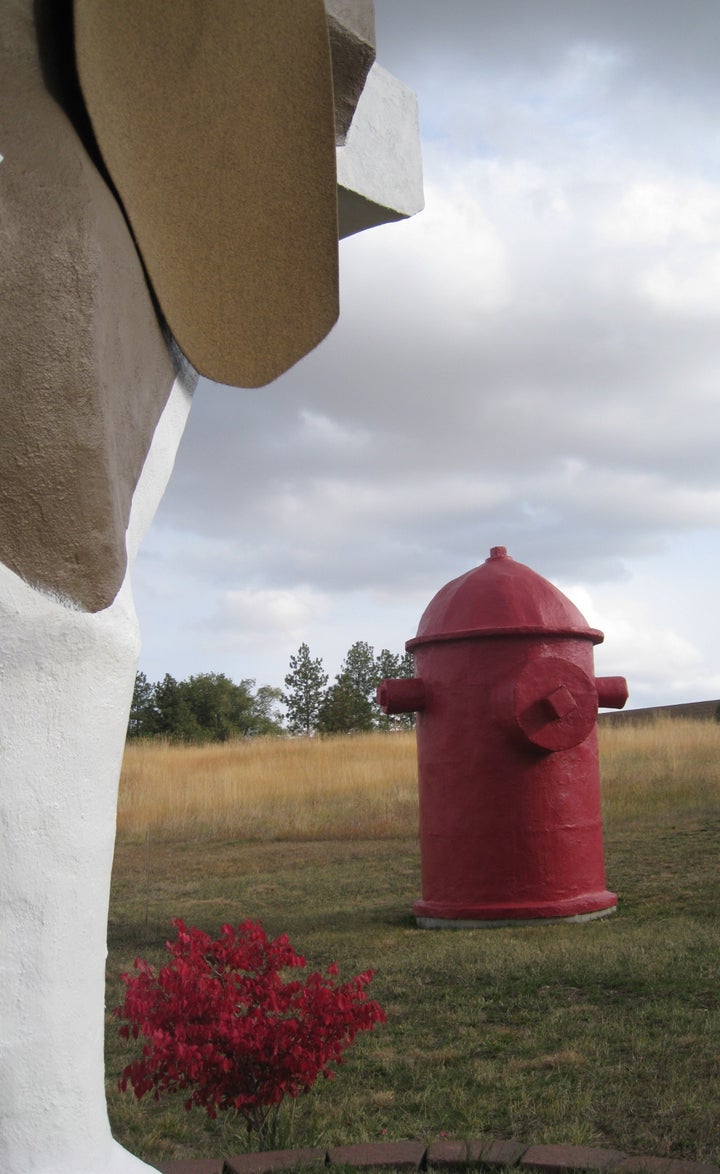 The fire hydrant sculpture has a bathroom inside.