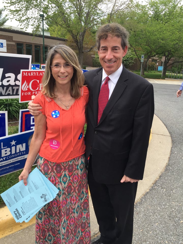 The author handing out literature at a polling place during primary early voting. To her left is Jamie Raskin, Democratic candidate for the US Congress.