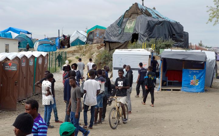 <strong>Migrants walk in the northern area of the camp called the "Jungle" in Calais, France</strong>