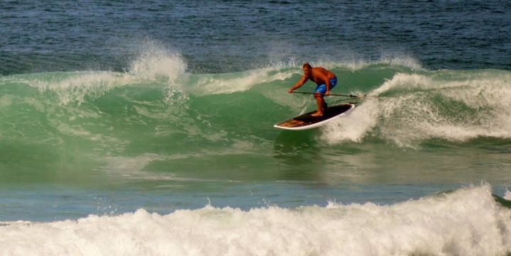 Reuben May, FatStick, SUPing his heart out on one of his boards