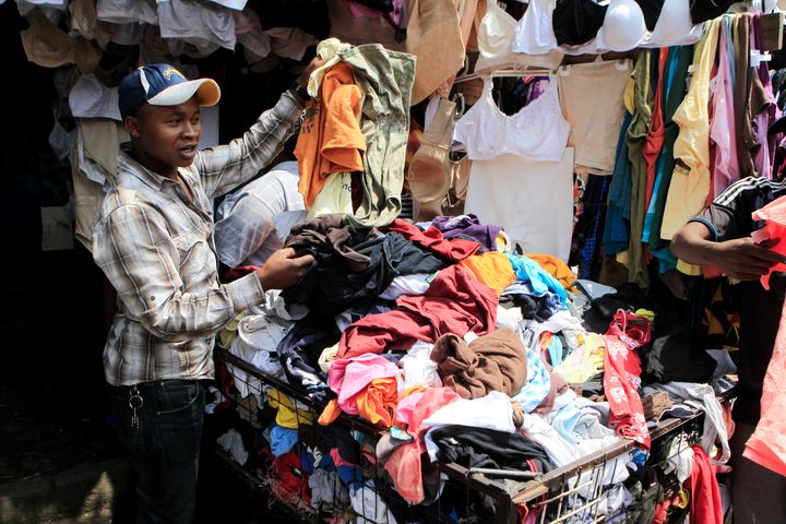 A vendor sells secondhand cloths at a stall in the busy Gikomba market in Nairobi, Kenya, Sept. 18, 2014. Shaded by ragged squares of canvas, amid choking dust and the noise of hawkers, shoppers can turn up Tommy Hilfiger jeans or a Burberry jacket for a fraction of the price in London's Regent Street or New York's Fifth Avenue.