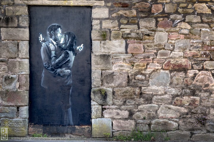 Banksy, "Mobile Lovers," 2014