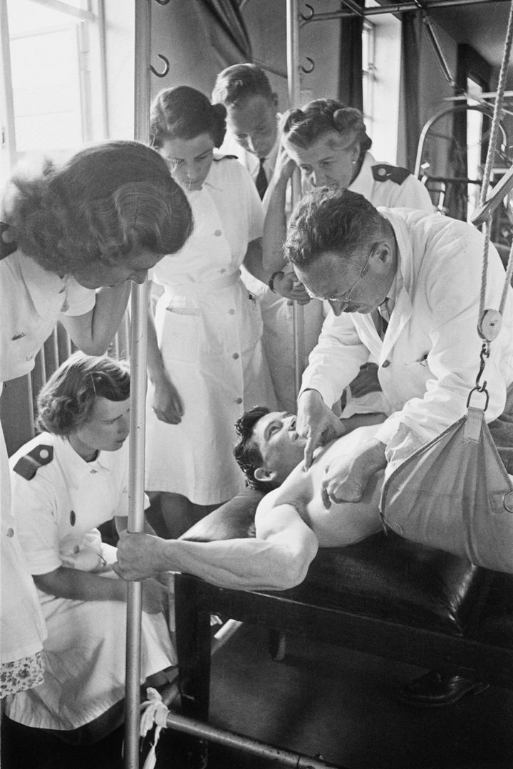 Ludwig Guttmann instructing a group of physiotherapists at the National Spinal Injuries Centre at Stoke Mandeville Hospital in 1949.