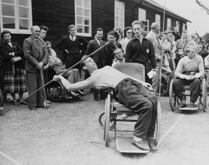 Joep de Beer of Doorn, Holland, leans into the javelin from his wheelchair during the Stoke Mandeville Games for paraplegic contestants.