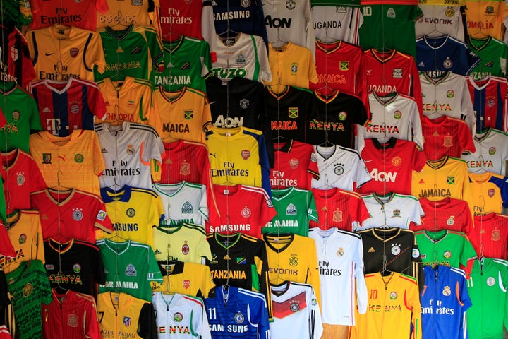 Secondhand sport jerseys are displayed at a stall in the busy Gikomba market in Nairobi, Sept. 24, 2014.