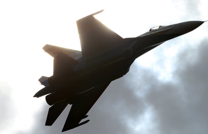 A Russian fighter jet performs at an air show. A Russian Sukhoi Su-27 fighter jet came within 10 feet of