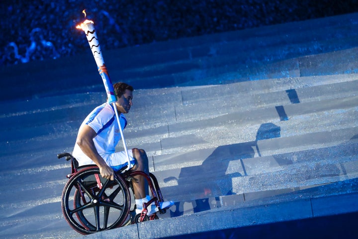 Silva climbs a ramp past the stairs