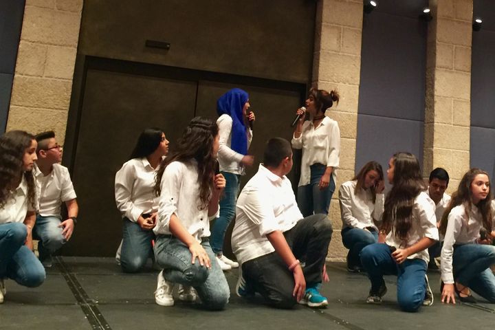 In Jerusalem, two choirs of teenagers sing "Not Everything is from Allah"