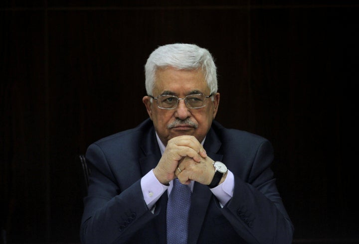 Palestinian President Mahmoud Abbas heads a Palestinian cabinet meeting in the West Bank city of Ramallah July 28, 2013.