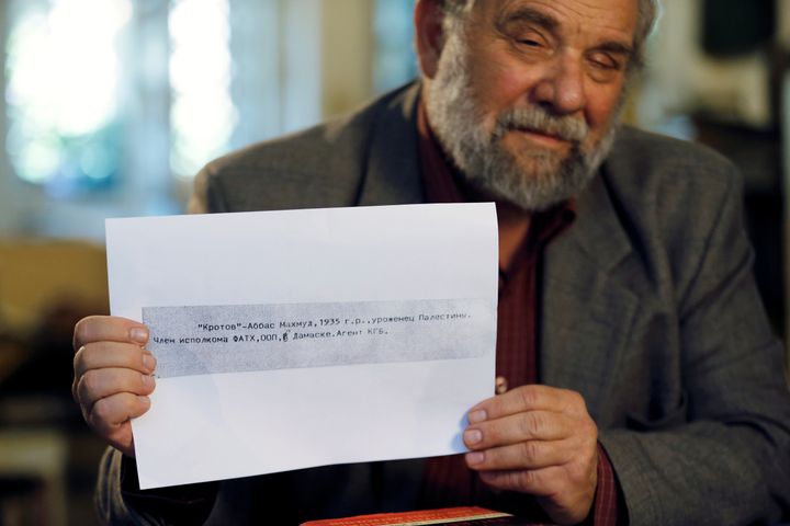Gideon Remez, one of the Israeli researchers who said on Thursday that Soviet-era documents showed that Palestinian President Mahmoud Abbas worked in the 1980s for the KGB, holds up a page he received after some documents smuggled out of Russia by a former KGB archivist were released for public research two years ago.