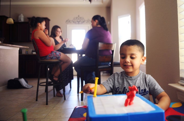 Kane plays with a toy at the home of his family in El Paso, Texas, U.S. on July 2, 2016. Kane's mother, Natalie Silva, contracted Methicillin-resistant Staphylococcus aureus, more commonly known as MRSA, a skin infection that can turn fatal once it enters the bloodstream, when she went to the hospital to give birth to Kane. After a 10 month battle with MRSA, Silva died, and her sisters have come together to raise her two children.