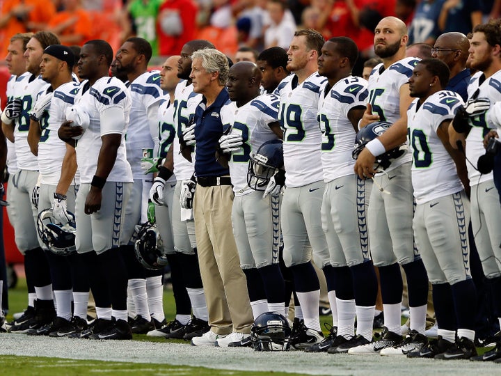 The Seahawks stand for the national anthem in 2012.