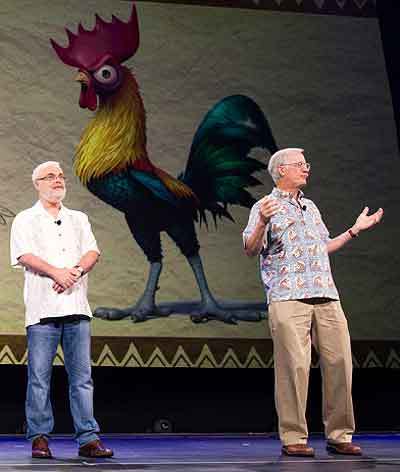 (L to R) Ron Clements and John Musker stand in front of an image of the earlier, smarter version of Heihei at last year's D23 EXPO.