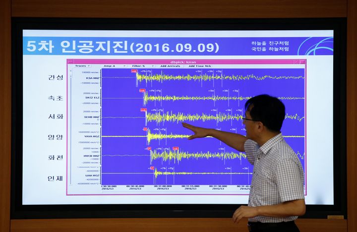 Ryoo Yong-gyu, Earthquake and Volcano Monitoring Division director, points at a chart showing seismic waves observed in South Korea following the bomb test