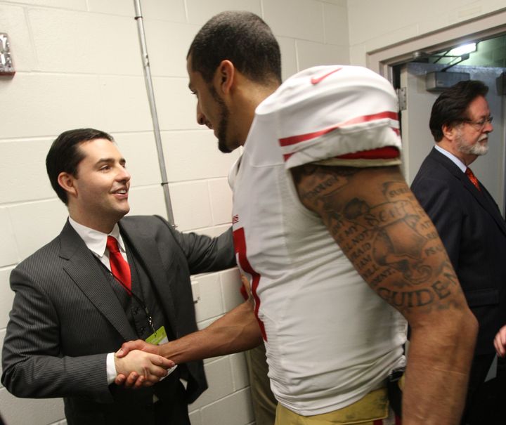 Jed York congratulates Colin Kaepernick in the locker room following a game against the Tampa Bay Buccaneers in 2013.