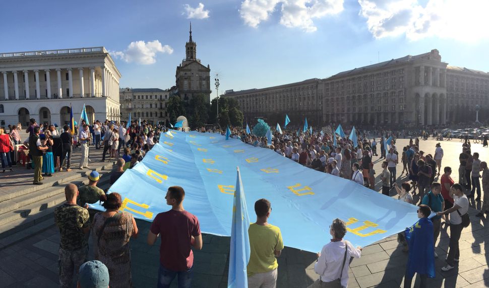 Crimean Tatars gather in Kiev's Independence Square for Crimean Tatar Flag Day on June 26, 2016.