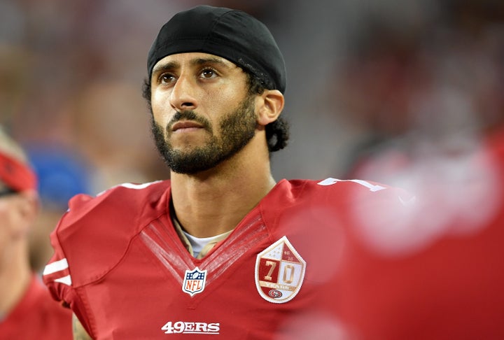 Colin Kaepernick looks on from the sidelines against the Green Bay Packers in the first half of a preseason football game at Levi's Stadium on August 26, 2016.