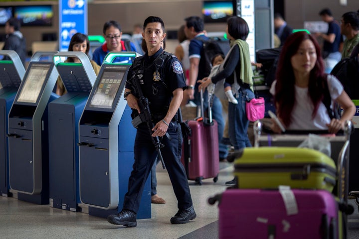 A U.S. Customs and Border Protection officer patrols Los Angeles International Airport on July 2, 2016.