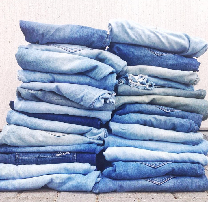 Stacks of Mud Jeans pants.