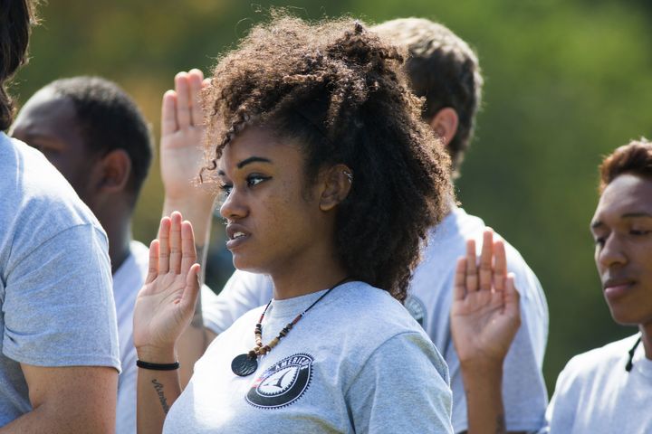 Members of the 2014 graduating class of AmeriCorps take their Pledge of Service at a ceremony on the South Lawn of the White House in Washington.