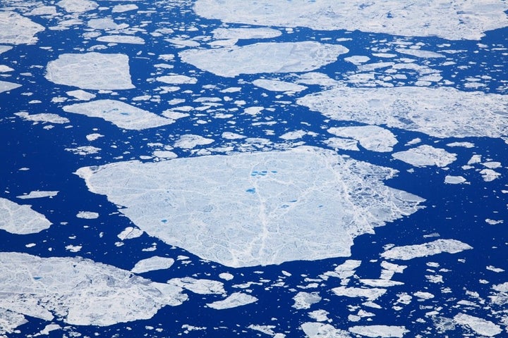 Ice flows off the east coast of Baffin Island. The world's oceans have absorbed the vast majority of the heat produced by human activities leading to changes in the Arctic ocean ecosystem.