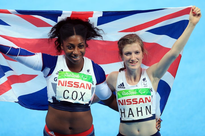 Great Britain's Sophie Hahn (gold) and Kadeena Cox (Bronze) celebrate after the Women's 100m - T38 final.