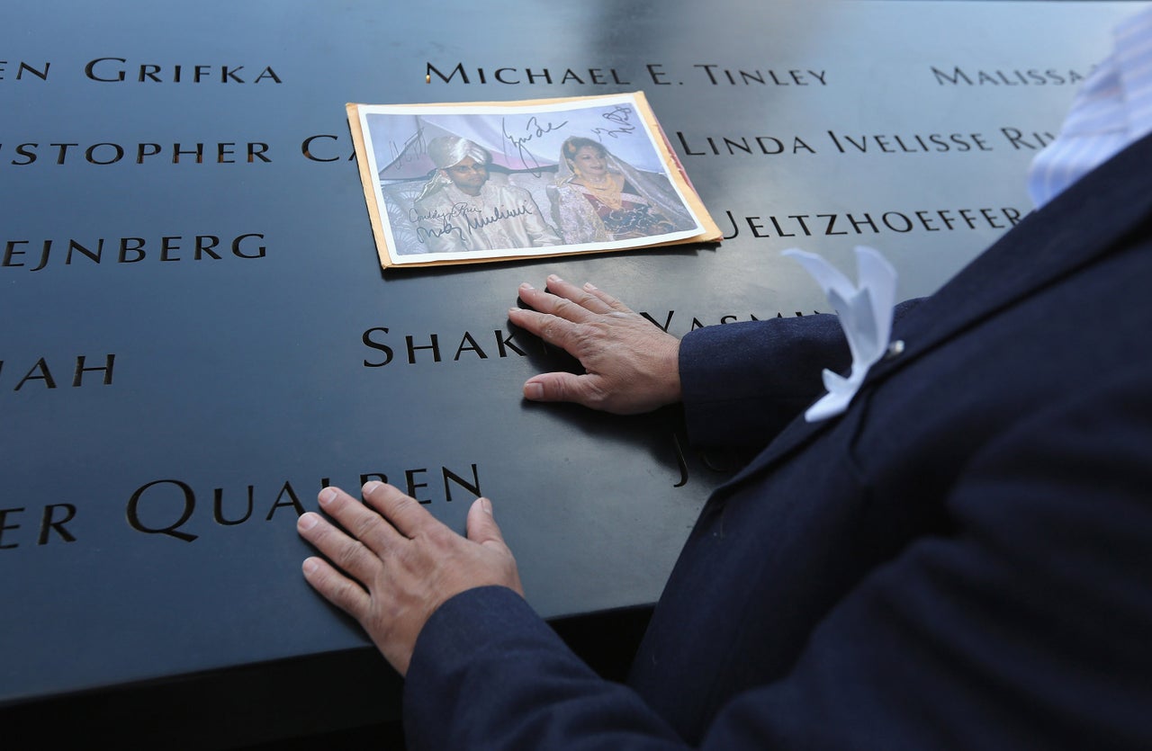 Mohammad Salam pays his respects during ceremonies marking the 11th anniversary of the 9/11 attacks on the World Trade Center in New York City. Salam lost his uncle Nural Miah and his uncle's wife, Shakila Yasmin, (in photo) in the attacks.