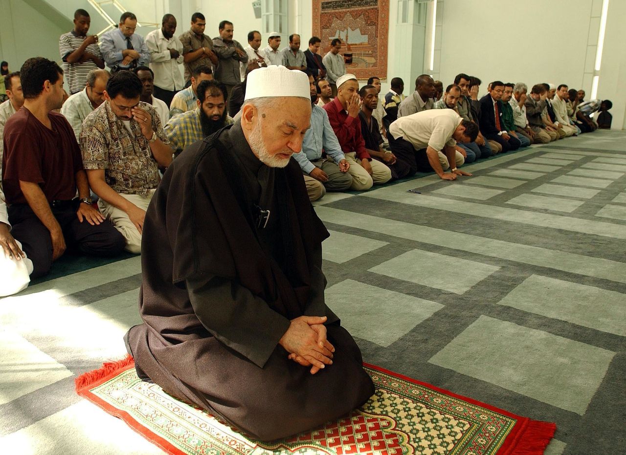 Imam Omar Abu Namous leads a remembrance prayer service at the Islamic Cultural Center in New York City on Sept. 11, 2002.
