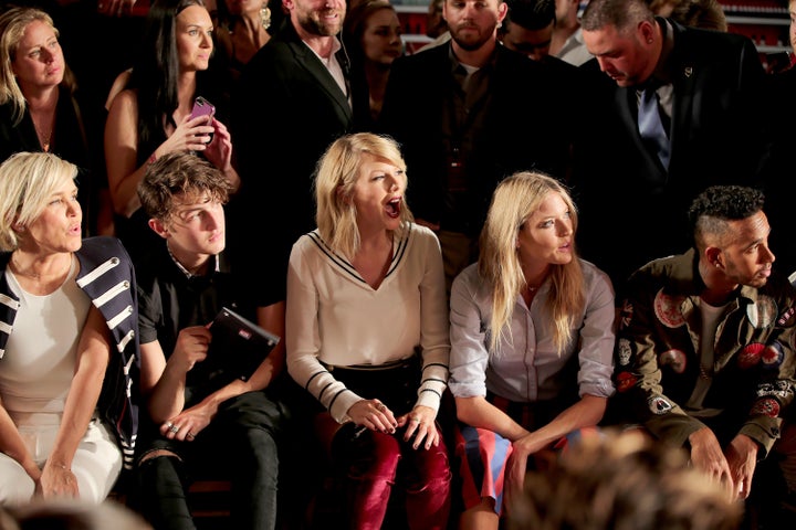 Taylor Swift and model Martha Hunt appear during New York Fashion Week on Friday.