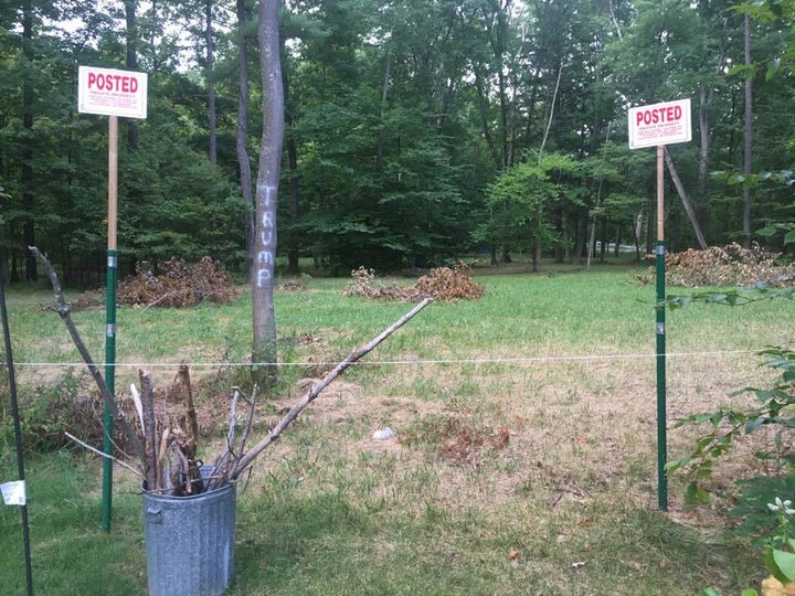 No trespassing signs and Trump spray paint erected after the rainbow flag went up