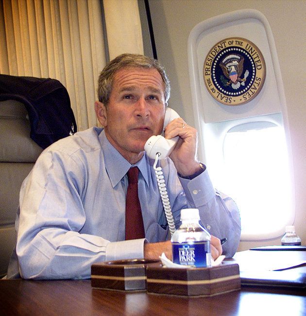 George W. Bush talks on the phone with New York Mayor Rudy Guiliani and Gov. George Pataki aboard Air Force One 11 September, 2001
