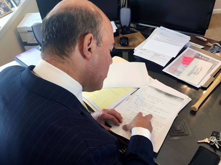 Ari Fleischer looks over 9/11 notes during an interview with Reuters in his office in Bedford, New York, U.S. September 7, 2016.
