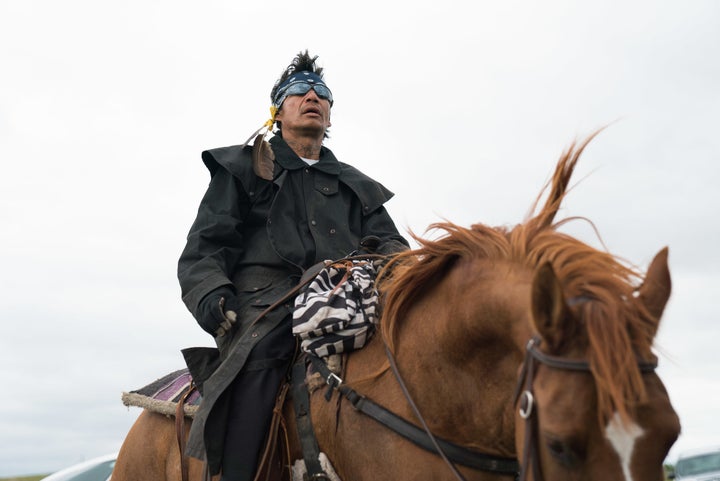 A man on horseback protests the Dakota Access Pipeline's construction during a rally in North Dakota.