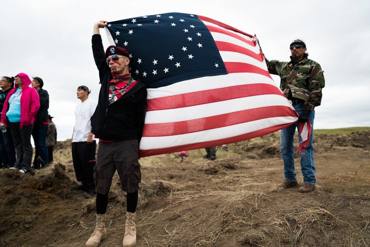 Protesters wave a flag in Cannon Ball, North Dakota.