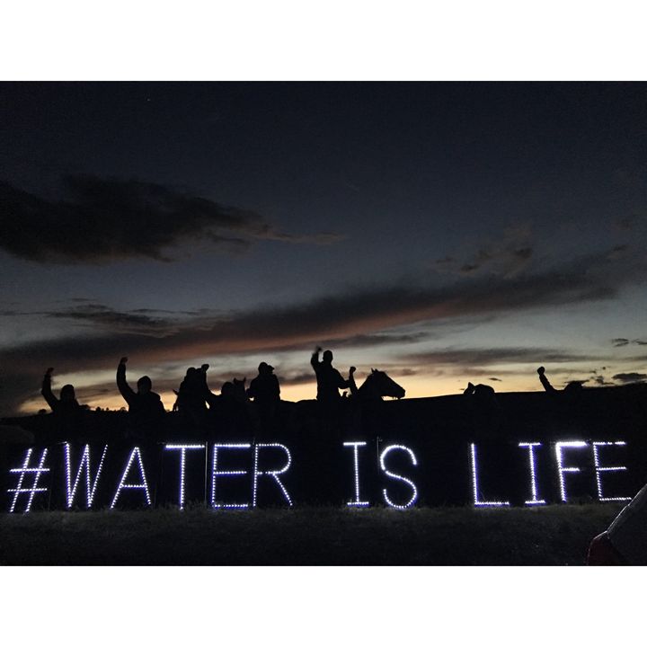 LED lights spell out a message against the construction of the pipeline.