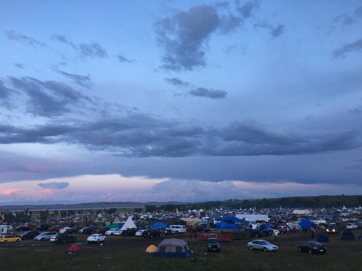 Teepees mix with camping tents, cars and RVs during weekend demonstrations.