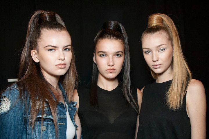 September 8: Models pose for a photo backstage before the Nicholas K show. 