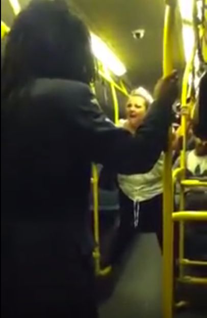 <strong>The woman in white abuses the man before the exchange turns violent</strong>