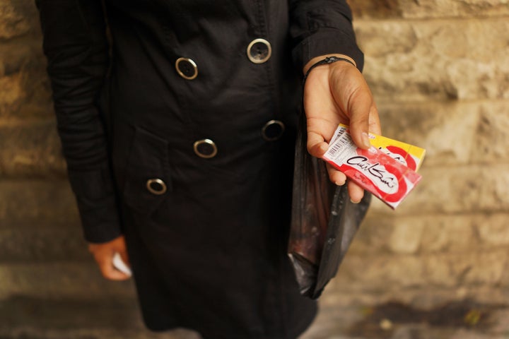 NOVEMBER 16: A Syrian woman from Kafer Hend, Syria sells chewing gum in a wealthy district of Beirut on November 16, 2013 in Beirut, Lebanon.