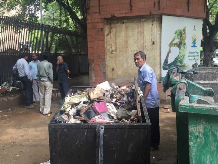 Ragpicker at waste collection site set to be demolished by NDMC. Delhi, India