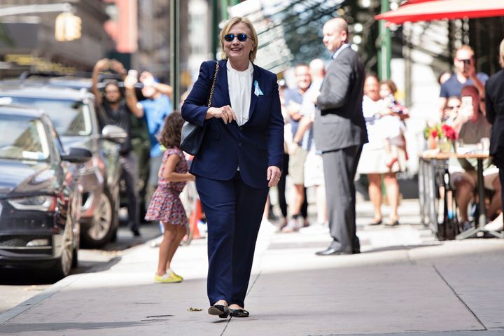 Hillary Clinton walked out of her daughter's apartment building on Sunday for the cameras. Earlier in the day, she'd left an event because she wasn't feeling well.