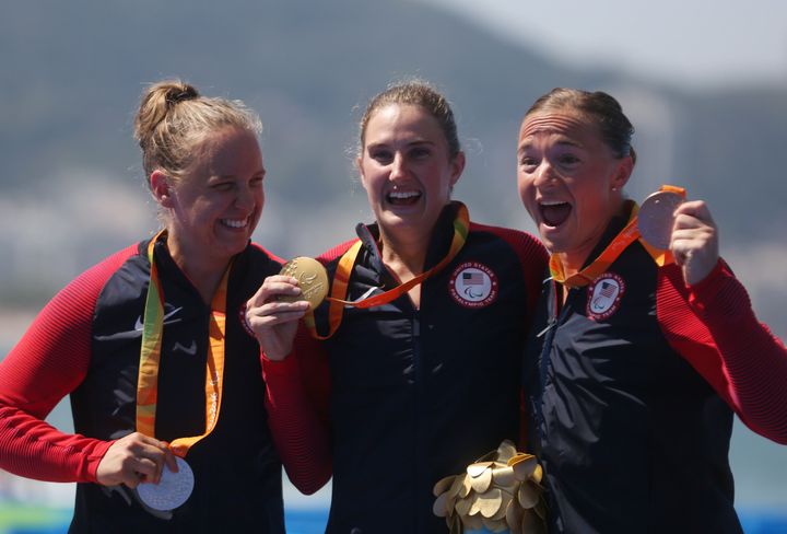 From left, Hailey Danisewicz, Allysa Seely and Melissa Stockwell of the United States celebrate their triathlon medals.