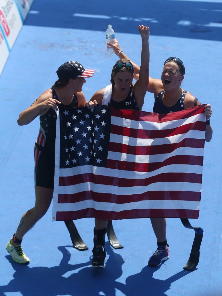 From left, Hailey Danisewicz, Allysa Seely and Melissa Stockwell after completing the first women's triathlon at the Paralymp