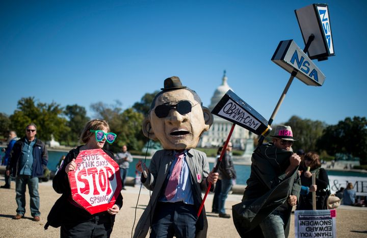 NSA surveillance protesters march in Washington to voice opposition to the government's surveillance of online activity and p